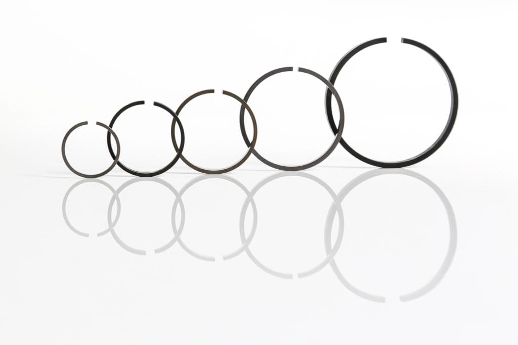 Turbocharger sealing and retaining rings
